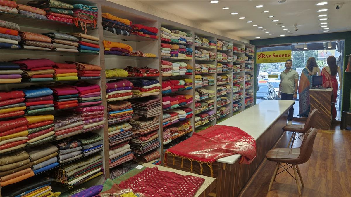 Inside ShriRam Sarees, a saree shop in Sector 18 Noida, with walls of Banarasi and silk sarees